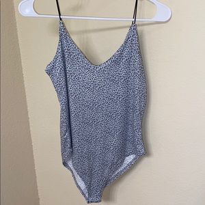 Grey and black body suit